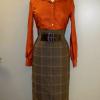 Stitching on this plaid skirt and copper blouse show how I strive for precision and quality in my work.
