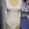 Lycra Spandex leotard base for an 8 month pregnancy belly. Single layer of cotton batting around torso.  Hip padding to begin building of curved belly.