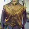 After being cut by the costume designer, I constructed this doublet.  It was flat lined, trimmed, surged and finally sewn together.  The wings adn tabs were bagged and surged as necessary. Please note that this image is not of the final product, but at a stage ready for fittings.