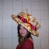 Wire framed, light weight 1900's derby hat.  The wire has been wraped in copper fabric prior to being covered by leaf printed chiffon.   Adorned with a satin ribbon, faux wheat straws and silk flowers.