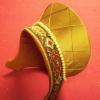 The hat has been lined in a rust colored poly cottonand covered in gold taffeta and a decorative ribbon that has been pieced together.  Lastly, the french hood has been adorned with a string of pearls.